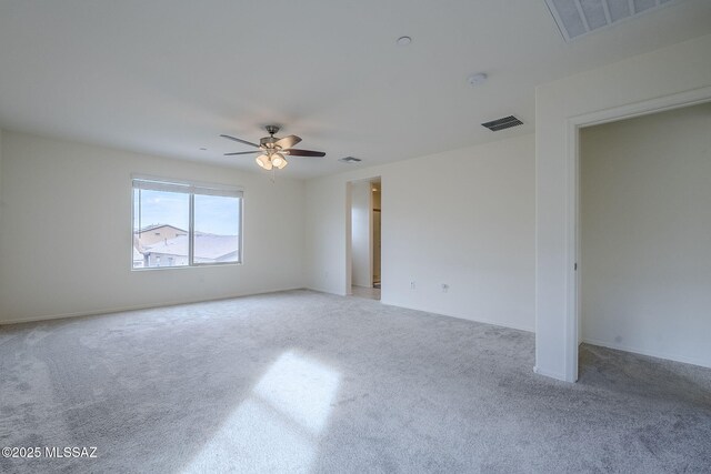 empty room with recessed lighting and light colored carpet