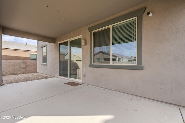 view of patio / terrace featuring fence