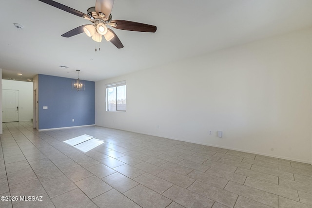 unfurnished room with light tile patterned floors, baseboards, visible vents, and ceiling fan with notable chandelier