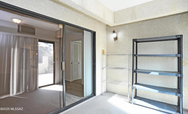 exterior space featuring visible vents and stucco siding