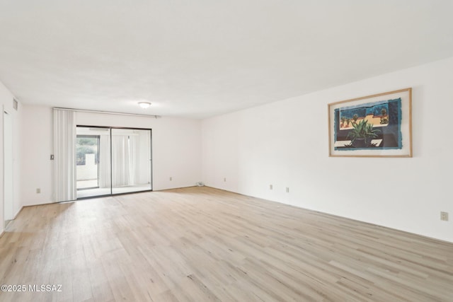 empty room featuring light wood finished floors