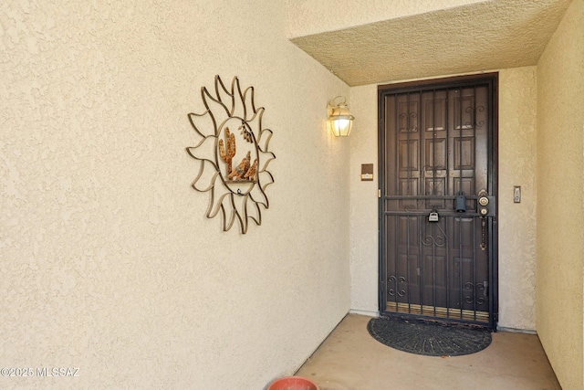 doorway to property with stucco siding