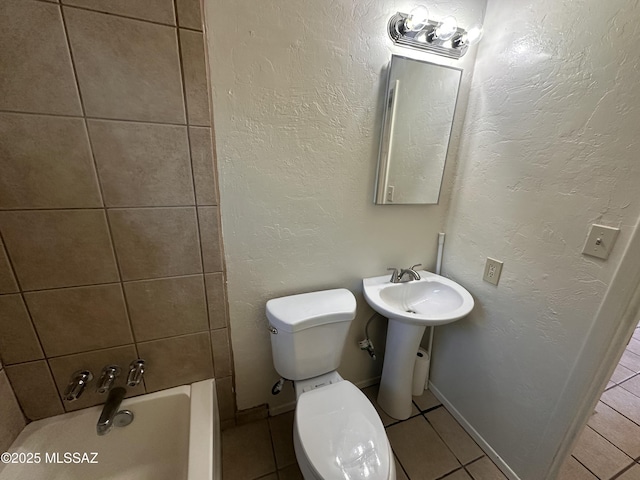 bathroom featuring toilet, tub / shower combination, and tile patterned flooring