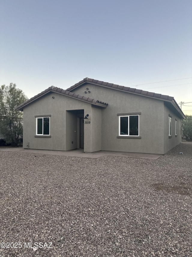 rear view of house featuring a patio