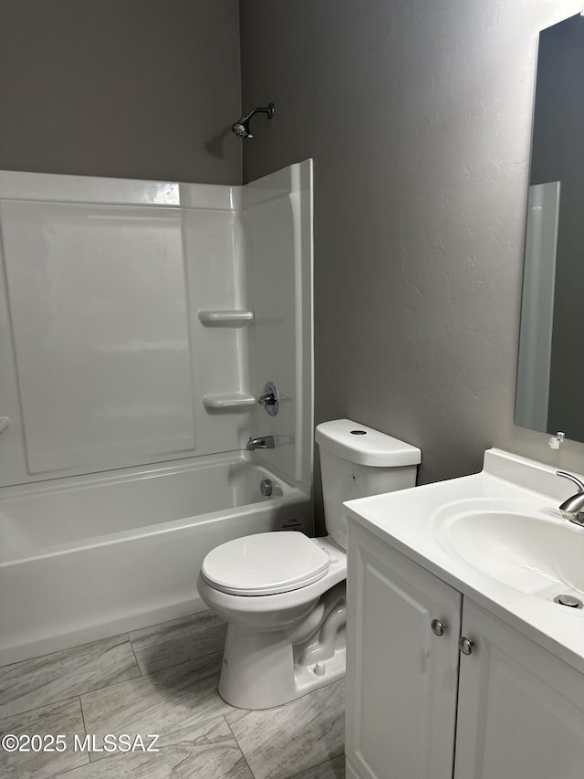 full bathroom with toilet, vanity, and shower / bathtub combination