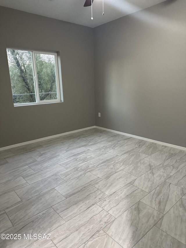 empty room featuring ceiling fan