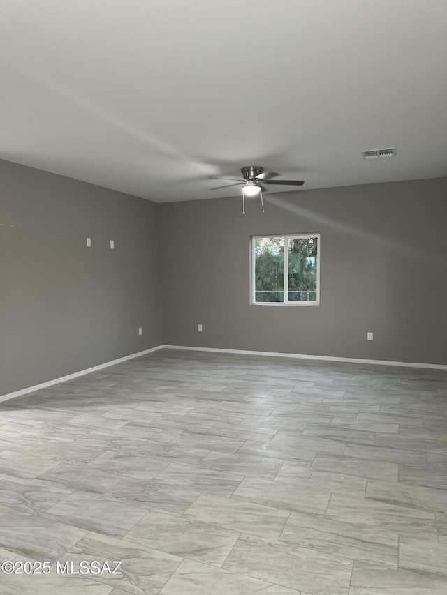 unfurnished room with ceiling fan