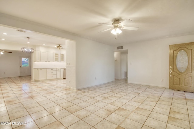 unfurnished room featuring ornamental molding, ceiling fan with notable chandelier, and light tile patterned floors