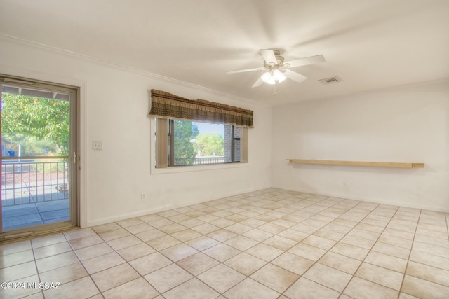 tiled empty room with a wealth of natural light, ornamental molding, and ceiling fan