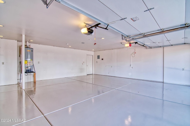 garage featuring a garage door opener and water heater