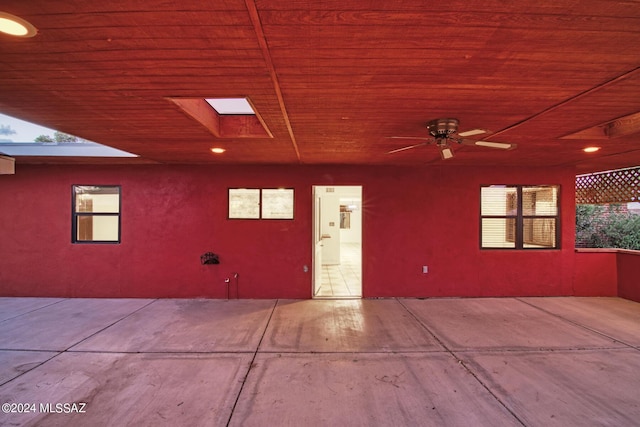 property entrance featuring a patio area and ceiling fan