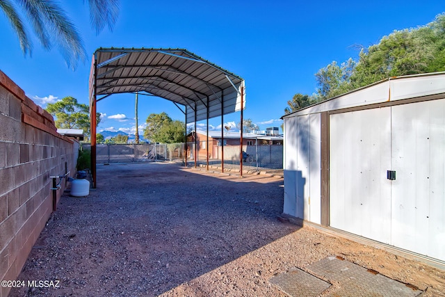 exterior space with a carport