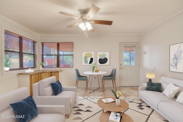 living room with light tile patterned floors, ornamental molding, and ceiling fan