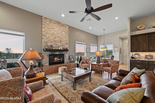 living area with a fireplace, recessed lighting, visible vents, light tile patterned flooring, and ceiling fan