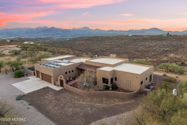 view of front of home featuring a mountain view