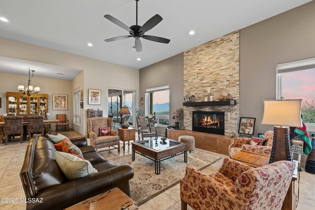 tiled living room featuring ceiling fan and a fireplace