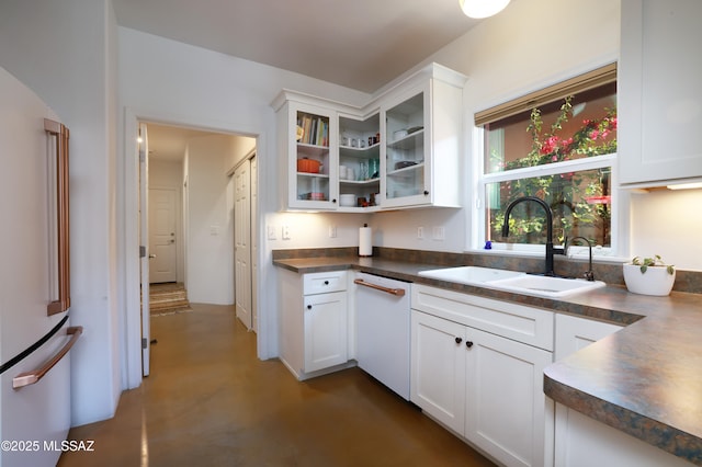 kitchen featuring white dishwasher and white cabinets