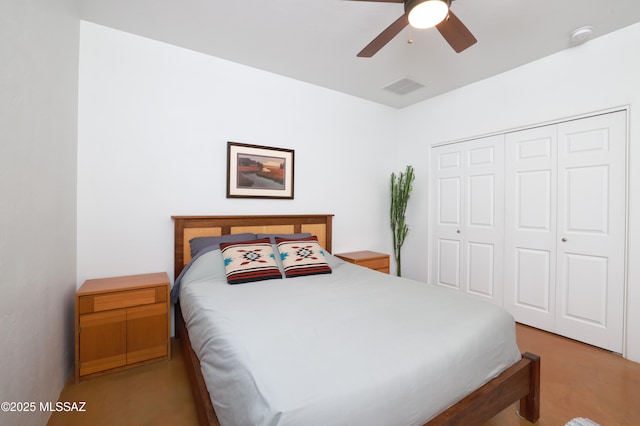 bedroom with ceiling fan and a closet