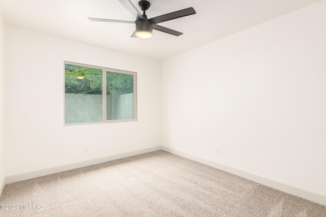 carpeted empty room with ceiling fan