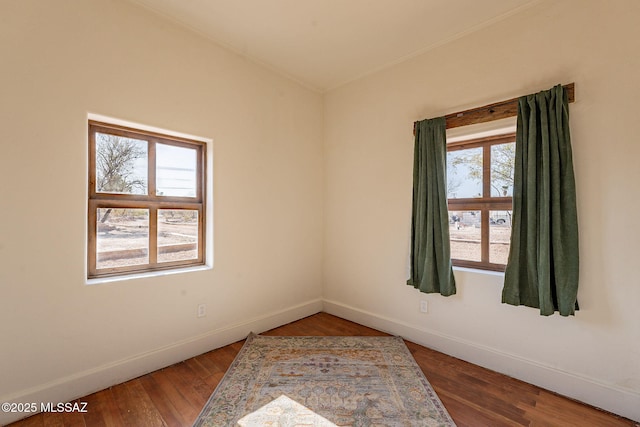 spare room featuring hardwood / wood-style flooring