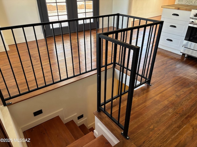 stairway featuring hardwood / wood-style flooring