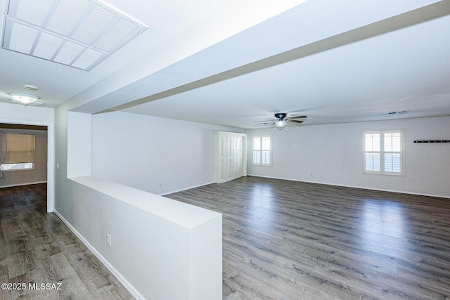 unfurnished room with ceiling fan and dark hardwood / wood-style floors