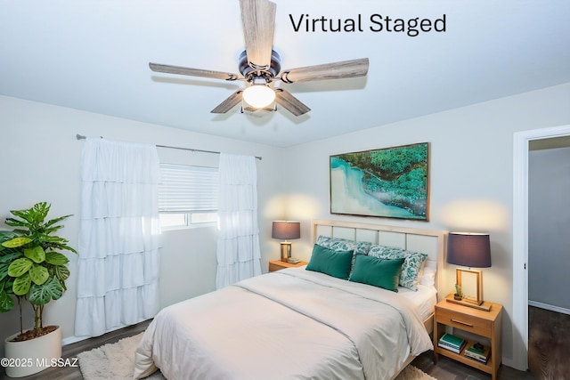 bedroom with ceiling fan and dark hardwood / wood-style floors