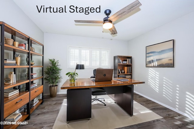 office featuring dark hardwood / wood-style floors and ceiling fan