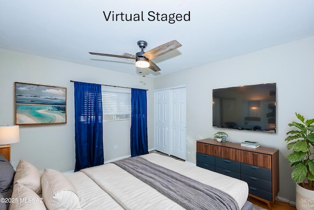 bedroom featuring ceiling fan and a closet