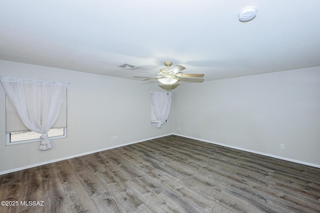 spare room with hardwood / wood-style floors