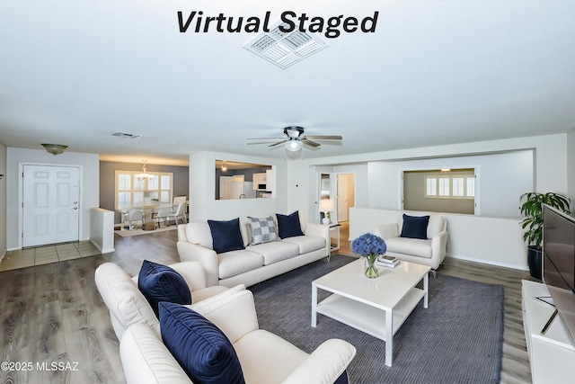 living room with hardwood / wood-style flooring and ceiling fan