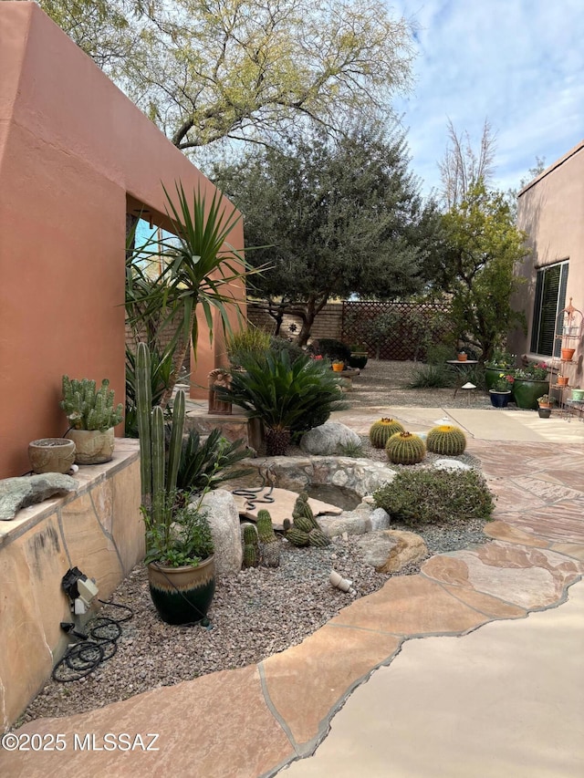 view of yard with a patio and fence