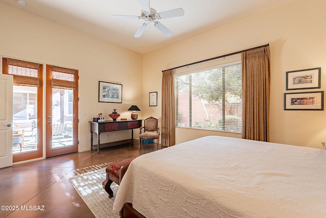 bedroom with concrete floors, ceiling fan, and access to outside