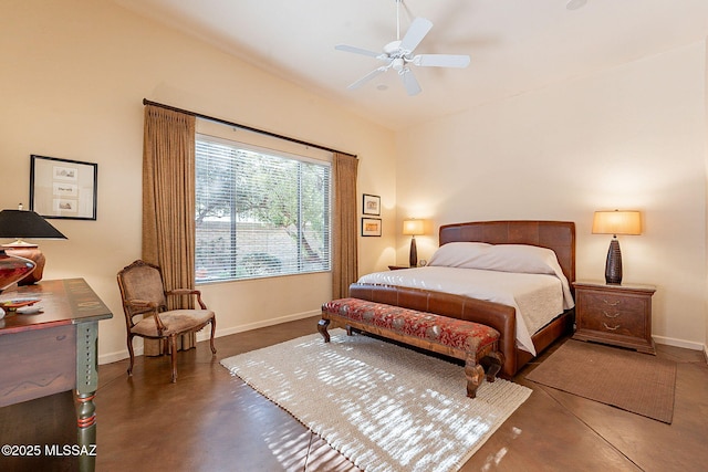 bedroom featuring baseboards, finished concrete flooring, and a ceiling fan