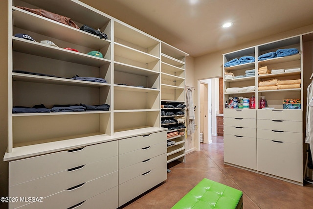 spacious closet with light tile patterned flooring