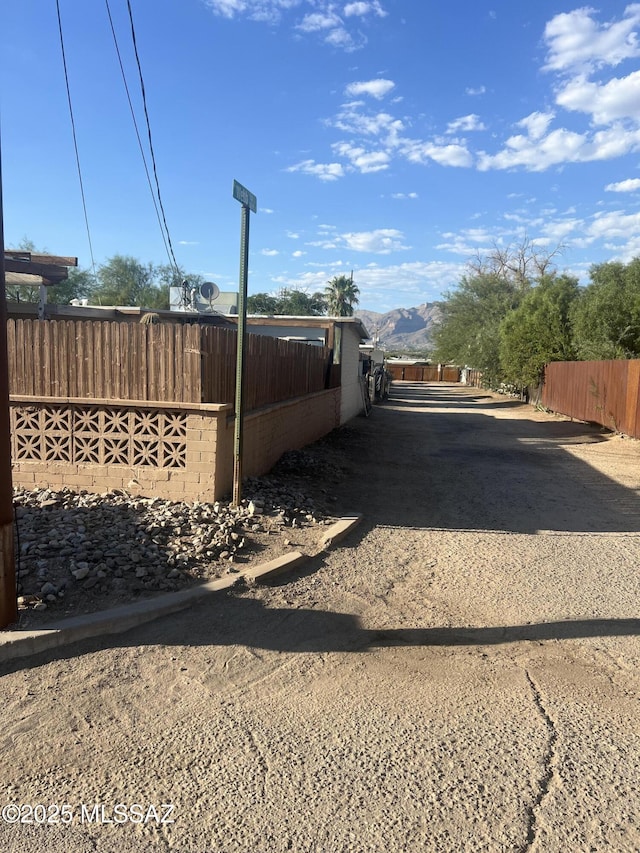 view of side of home featuring a mountain view