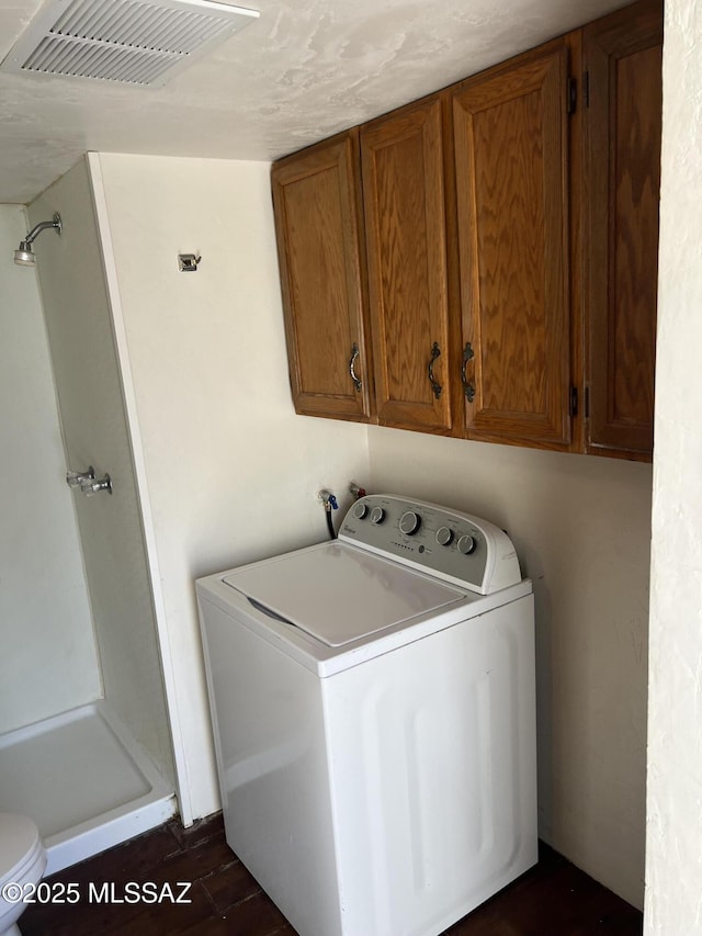 laundry area featuring dark hardwood / wood-style flooring and washer / clothes dryer