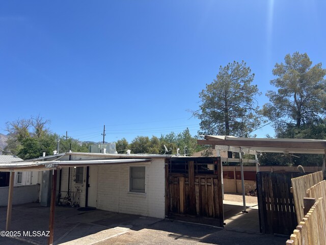 view of patio / terrace with a carport