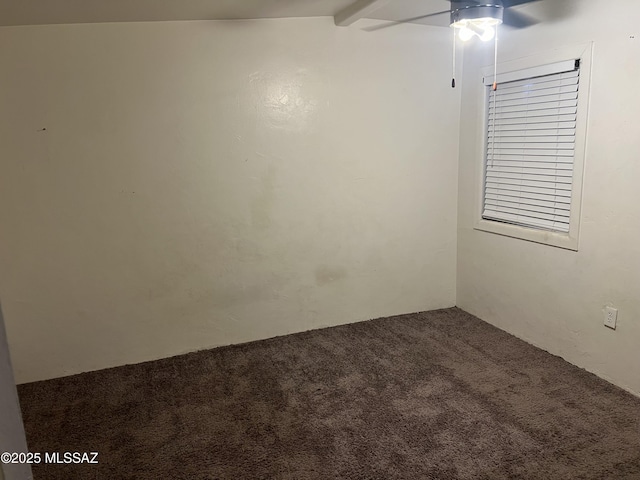 unfurnished room with carpet and lofted ceiling with beams