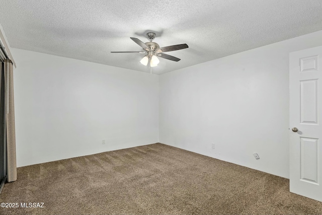 empty room with carpet flooring, a textured ceiling, and ceiling fan