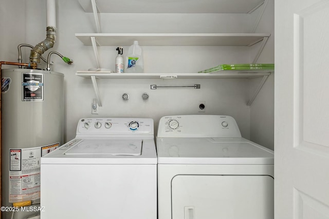 washroom with separate washer and dryer and gas water heater