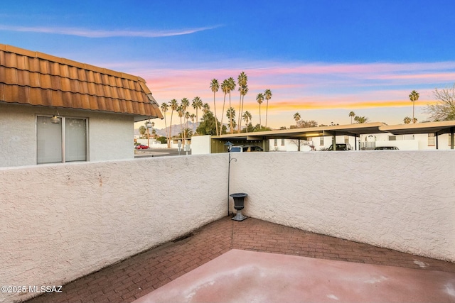 view of patio terrace at dusk