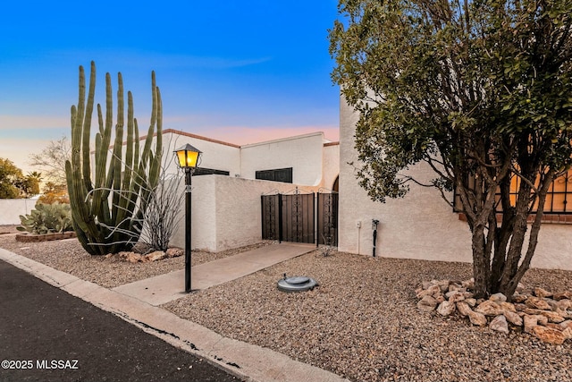 view of property exterior at dusk