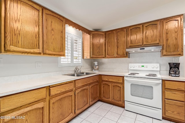 kitchen with sink, light tile patterned flooring, lofted ceiling, and white electric range