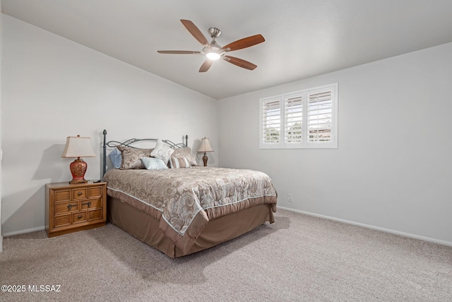 carpeted bedroom with ceiling fan and lofted ceiling