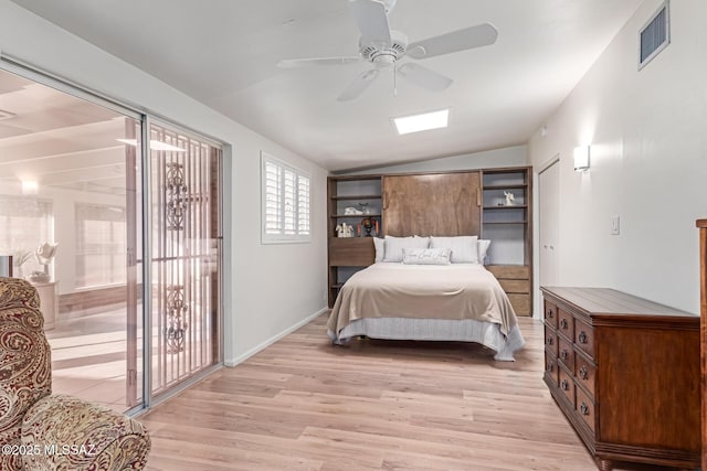 bedroom with ceiling fan, light hardwood / wood-style floors, and lofted ceiling