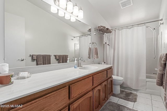 full bathroom featuring toilet, vanity, tile patterned floors, and shower / bath combo with shower curtain