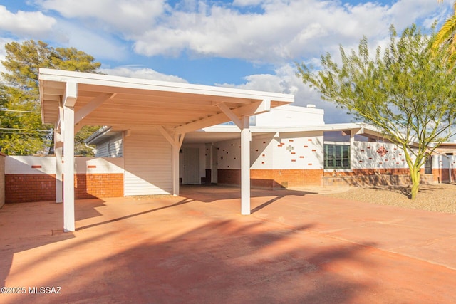 view of patio / terrace featuring a carport