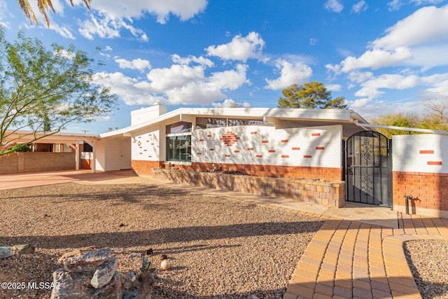 view of front of property with a carport