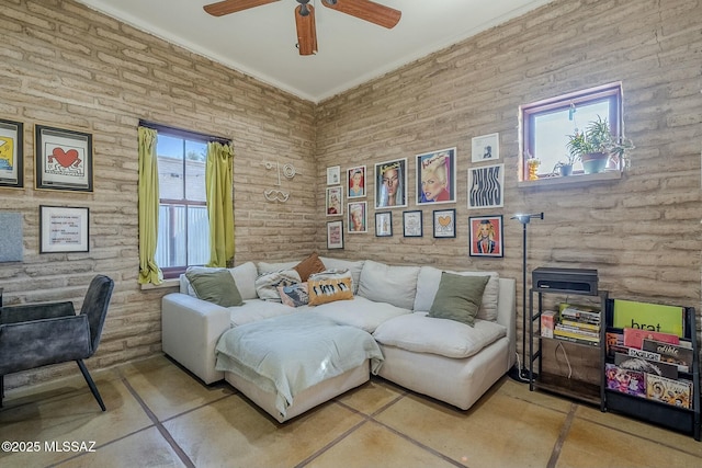 living room with ceiling fan and tile patterned flooring